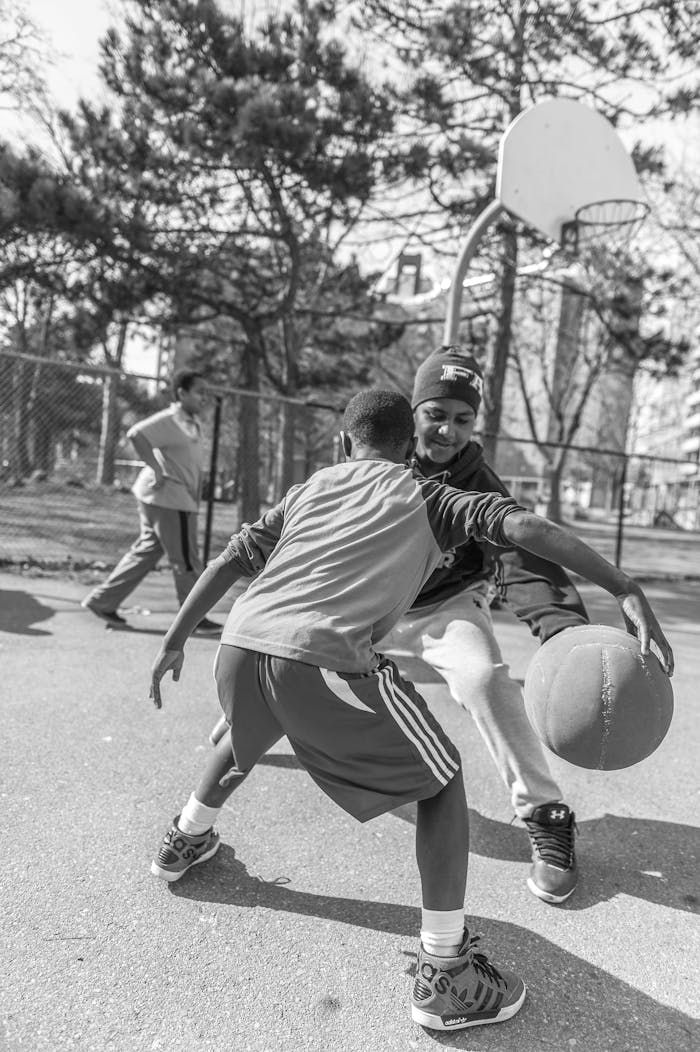 Monochrome Photo Of Boys Playing Basketball